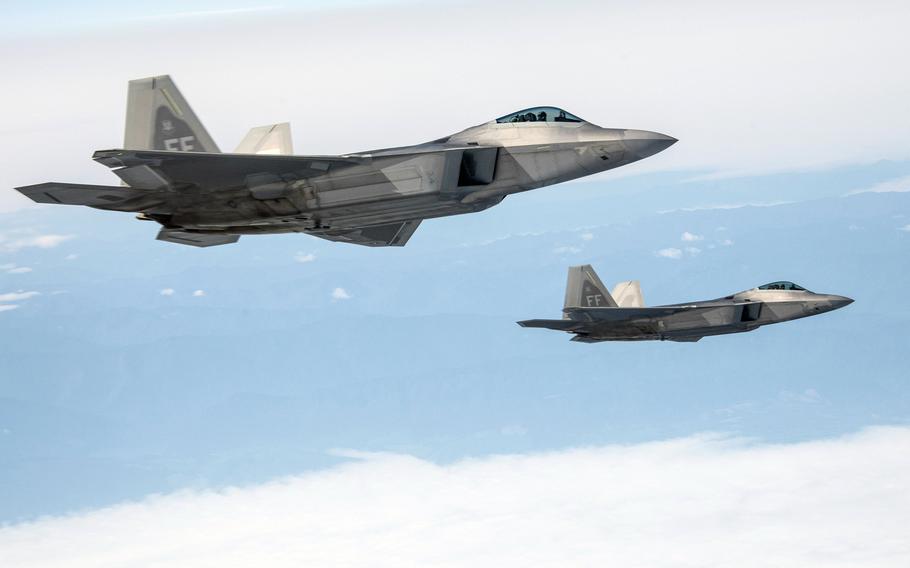 Two F-22 Raptors from the 1st Fighter Wing at Joint Base Langley-Eustis fly near Fairchild Air Force Base, Wash., on their way to an exercise over British Columbia, Canada,May 27, 2015. Air Force Secretary Deborah James told reporters during a stop at the Paris Air Show that the service could send a squadron of the aircraft to Europe in response to Russia's actions in Ukraine.