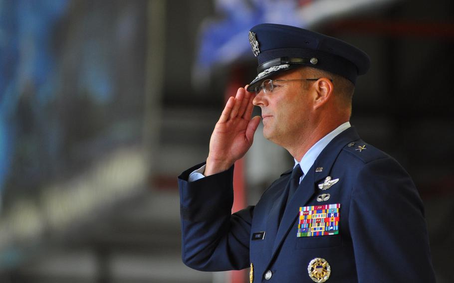 Brig. Gen. Jon T. "Ty" Thomas salutes during the 86th Airlift Wing change-of-command ceremony on Friday, June 19, 2015, at Ramstein Air Base, Germany. Thomas succeeds Brig. Gen. Patrick X. Mordente as the wing's new commander.