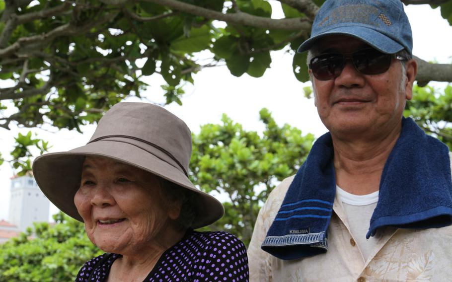 Toyo Nagado, left, attended Tuesday's ceremony with her son, Isao. Nagado lost seven family members during World War II, her parents, brothers and sisters.