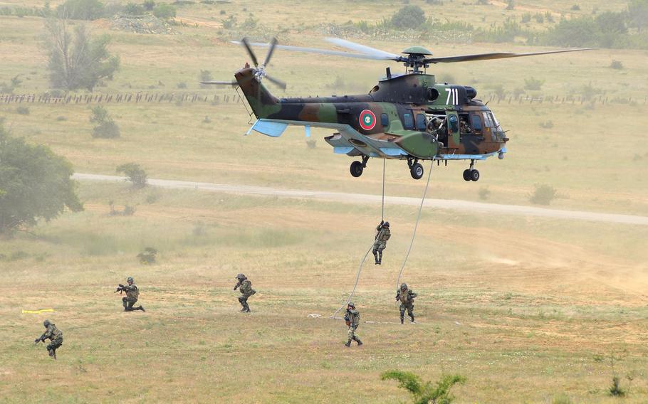 Bulgarian commandos rappel from a helicopter during a live-fire exercise that closed the Kabile 2015 tactical exercise at Novo Selo Training Area, Bulgaria, on Thursday June 25, 2015. About 50 U.S. Army troops from 3rd Combined Arms Battalion, 69th Armor Regiment and 2nd Squadron, 2nd Cavalry Regiment took part in the demonstration.