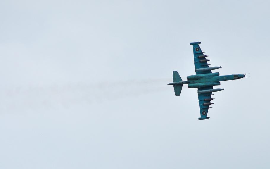 After firing rockets at a target, a Bulgarian air force Su-25 jet streaks across the sky over the Novo Selo Training Area, Bulgaria, during a live-fire exercise that closed the Kabile 2015 tactical exercise, Thursday June 25, 2015.