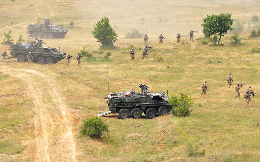 Soldiers of 2nd Squadron, 2nd Cavalry Regiment dismount from their Stryker vehicles during the live-fire exercise that closed the Kabile 2015 tactical exercise at Novo Selo Training Area, Bulgaria, on Thursday June 25, 2015. About 50 soldiers from 2-2 Cav and 3rd Combined Arms Battalion, 69th Armor Regiment took part in the demonstration.