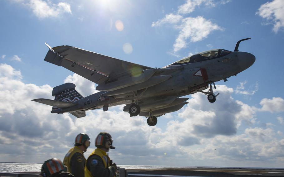 An EA-6B Prowler assigned to the ''Patriots'' of Electronic Attack Squadron 140 approaches the flight deck of the Nimitz-class aircraft carrier USS Dwight D. Eisenhower on February 24, 2013.