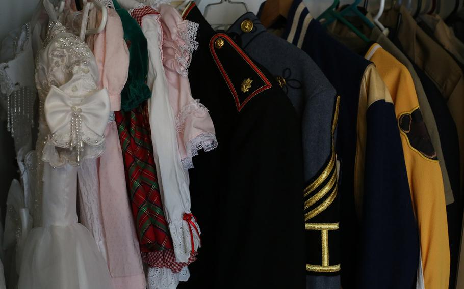 Connie Gruber has kept some of her husband's uniforms and jackets, along with some of the dresses Brooke wore as a little girl.