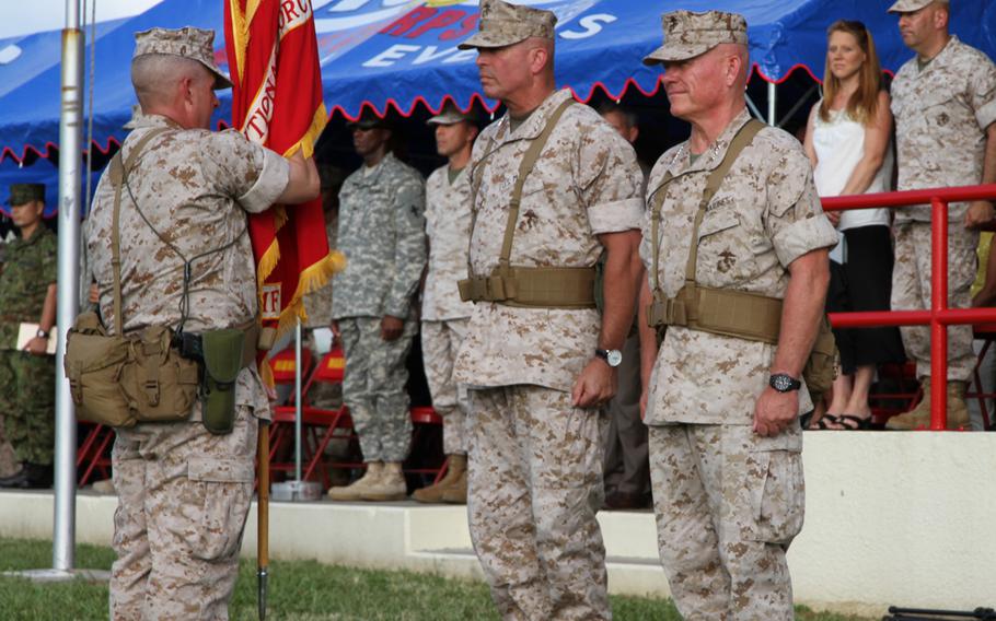 Marine Lt. Gen. John Wissler, center, relinquished command of Marine Forces Japan and III Marine Expeditionary Force to Lt. Gen. Lawrence Nicholson, right, on Sept. 11, 2015.