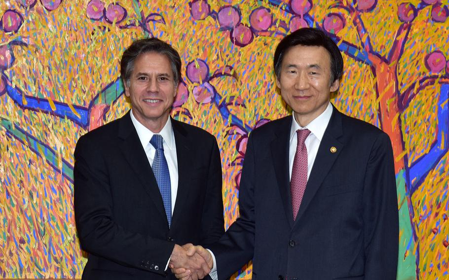 Deputy Secretary of State Antony "Tony" Blinken poses for a photo with South Korean Foreign Minister Yun Byung-se before their lmeeting in Seoul, South Korea, on October 6, 2015.