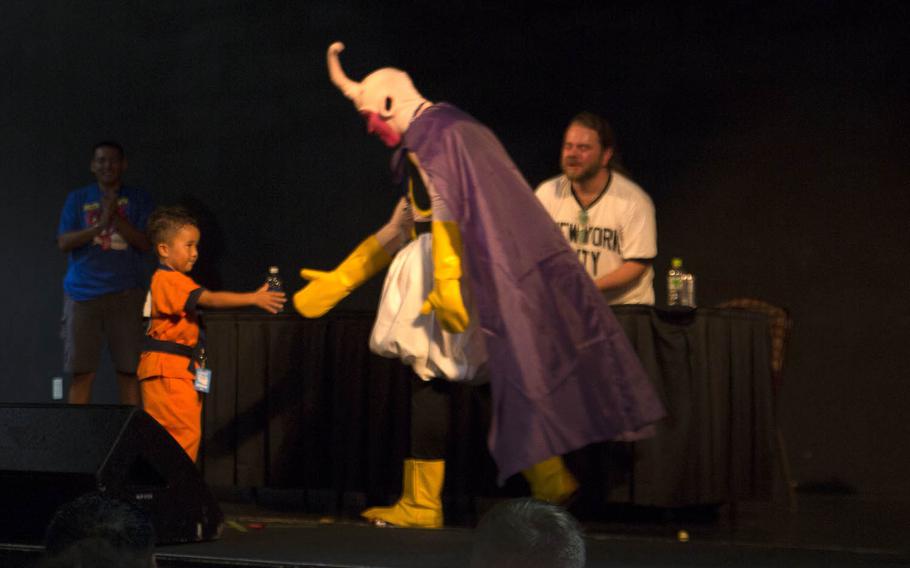 Finalists of a 'Kamehameha' contest congratulate each other Saturday, Oct. 17, 2015, during Comic Con Okinawa at Camp Foster, Japan. The contest was part of a panel discussion with voice actors from the popular anime series 'Dragon Ball Z' and required contestants to perform an iconic move from the series.