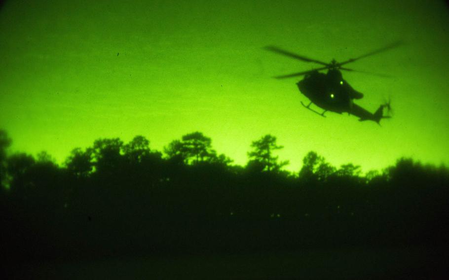 U.S. Marines assigned to Marine Light Attack Helicopter Squadron 167 and the Expeditionary Operations Training Group conduct fast-rope training at Marine Corps Base Camp Lejeune, N.C., Oct. 21, 2015.