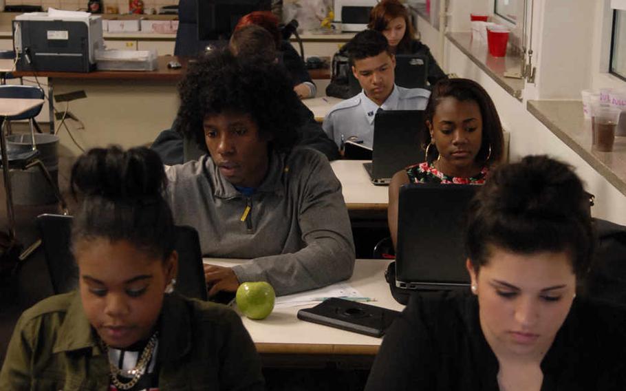 Sophomores at Kaiserslautern High School, Germany, use their school-issued laptops to write blog entries during a 2014 spring semester class. Some Department of Defense Education Activity schools are having extensive computer problems this school year that prevent teachers from tracking student progress. Two schools in Ramstein have a teacher work day on Friday to allow instructors to catch up on grades.