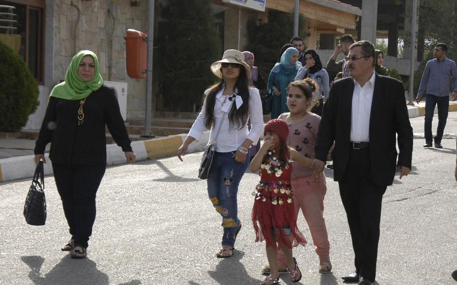 Families enjoy the late October sunshine at Pank Resort-Shnglbana, a destination in the mountains of northern Iraq that is popular with tourists.
