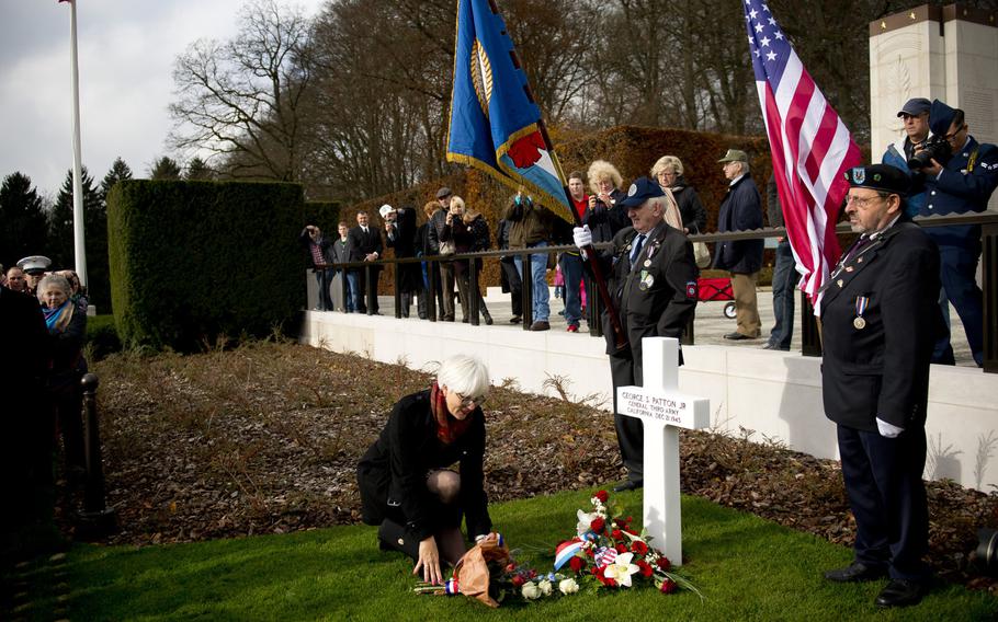 Helen Patton, Gen. George S. Patton Jr.'s granddaughter, lays flowers at his grave during a Veterans Day ceremony at the Luxembourg American Cemetery, Luxembourg, on Wednesday, Nov. 11, 2015. Gen. Patton was the Third Army commander during World War II, and played a critical role in the liberation of Europe.
