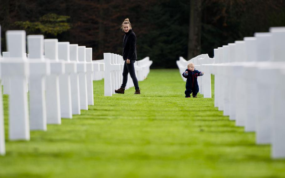 Visitors view the graves of fallen Americans after a Veteran's Day ceremony at the Luxembourg American Cemetery, Luxembourg, on Wednesday, Nov. 11, 2015.