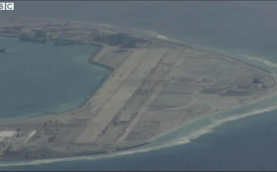 This screenshot from a BBC news video shows extensive construction efforts by the Chinese at Mischief Reef in the South China Sea, including a runway capable of accommodating military aircraft. A small plane chartered by the BBC drew a warning from the Chinese navy after it flew near the artificial island, according to a recent report.