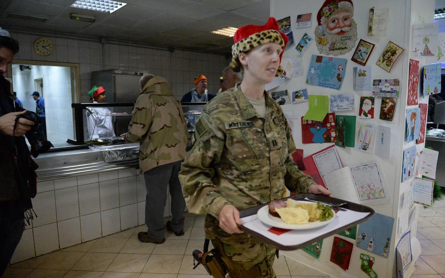 A U.S. soldier at Christmas dinner Friday at Resolute support headquarters in Kabul, Afghanistan. 