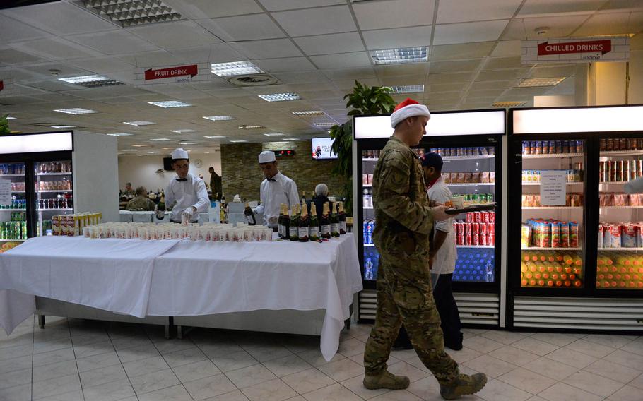Troops donned some Christmas gear Friday, Dec. 25, 2015, at a chow hall at Resolute Support headquarters in Kabul, Afghanistan. 