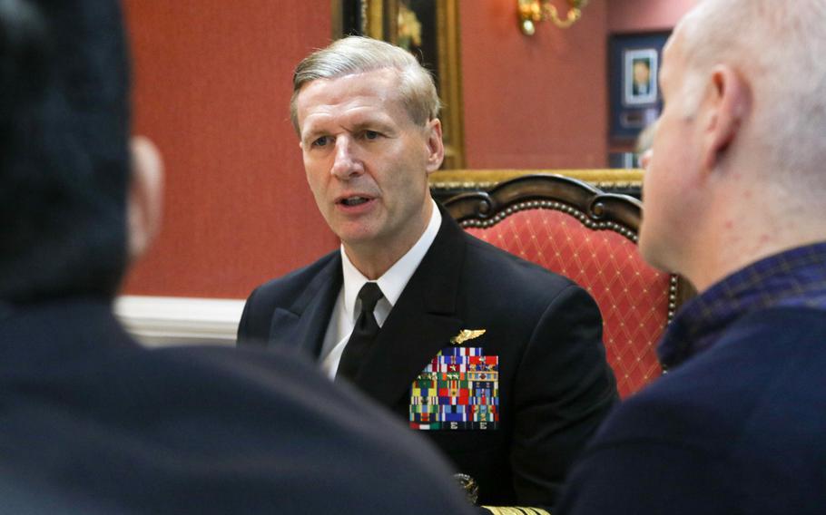 Vice Adm. Joseph P. Aucoin talks to journalists during a media roundtable aboard the USS Ronald Reagan, Jan 8, 2016.