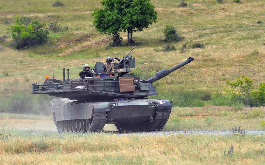 A U.S. Army M1A2 Abrams tank, manned by soldiers of the 3rd Combined Arms Battalion, 69th Armor Regiment, rumbles across Novo Selo Training Area, Bulgaria, following a live-fire exercise that closed the Kabile 2015 tactical exercise on Thursday June 25, 2015. A congressionally mandated panel has recommended that the Army return an armored brigade to Europe along with a war fighting aviation headquarters to counter a more aggressive Russia on the continent.
