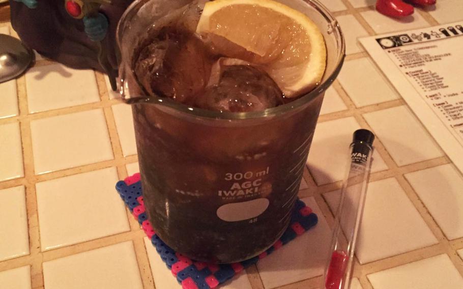 The Dr. Mario cocktail at 8 Bit Cafe is a nod to the 1990 puzzle game for the original NES. It's vodka, gin, Coke and Dr. Pepper served in a 300 ml beaker with a sugar pill-filled test tube on the side.