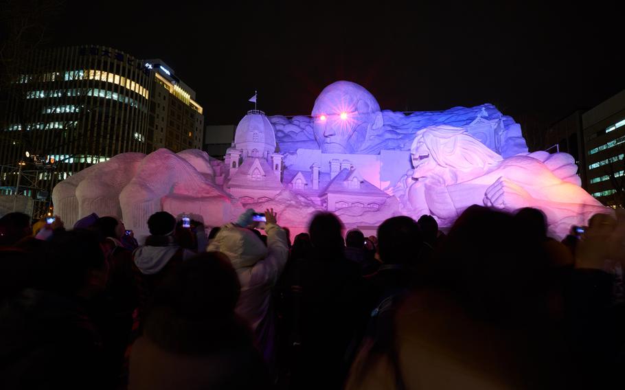 A rendition of the popular manga, ''Attack on Titan'' draws a large crowd at the Sapporo Snow Festival in Sapporo, Japan, on Feb. 5, 2016. The festival runs through Feb. 11.