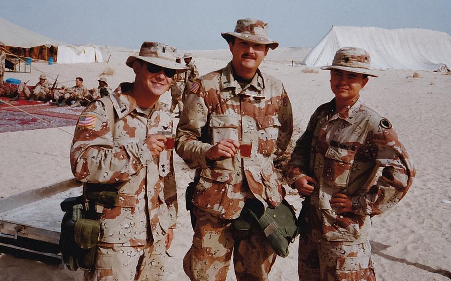 Platoon leader 1st Lt. Fred Wellman poses with two of his aviators, CW2 Hal Reichle, center and SPC Mike Daniels, right while posted in Saudi Arabia in 1990 ahead of Operation Desert Storm. Reichle, a scout helicopter pilot, and Daniels, his aerial observer, were killed in a route reconnaissance mission days before the start of the ground war.
