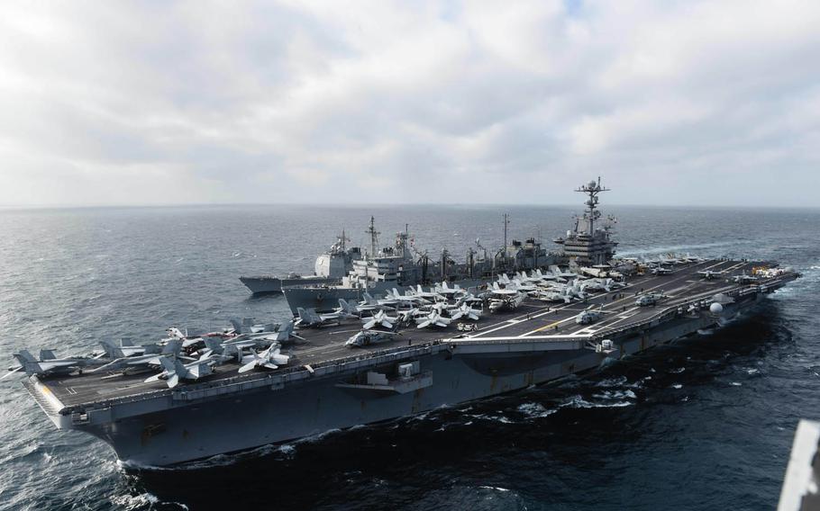 The USS John C. Stennis participates in a replenishment in the South China Sea with the USNS Rainier and the guided-missile cruiser USS Mobile Bay, March 4, 2016. Freedom of navigation in Asia-Pacific waters has limits, China's foreign minister said Tuesday, March 8, 2016, in a thinly veiled rebuke aimed at U.S. Navy movements in the South China Sea.