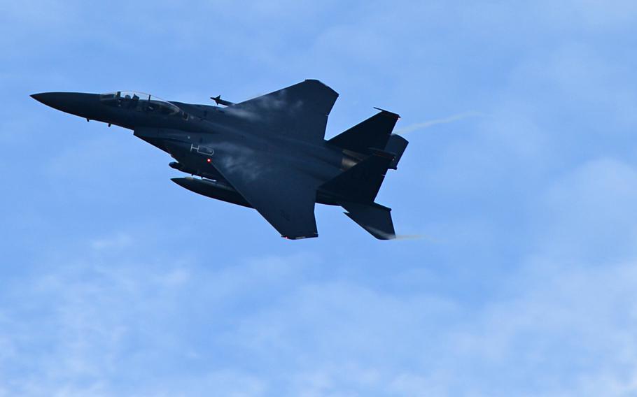A 494th Fighter Squadron F-15E Strike Eagle soars through the sky at Royal Air Force Lakenheath, England, Dec. 30, 2014. The crew of an F-15E was ''momentarily disoriented'' by a laser beam as it was landing at RAF Lakenheath on Wednesday, March 2, 2016.