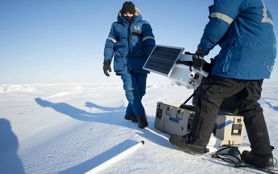Aerographer's Mate 2nd Class Zachary Yanez, left, and Aerographer's Mate 1st Class Daryl Meer, both assigned to Fleet Weather Center Norfolk, set up a mobile weather station in the Arctic Circle during Ice Exercise 2016. The sailors are trying to accurately forecast arctic weather in an attempt to predict the harsh conditions that can constrain military operations in the region.