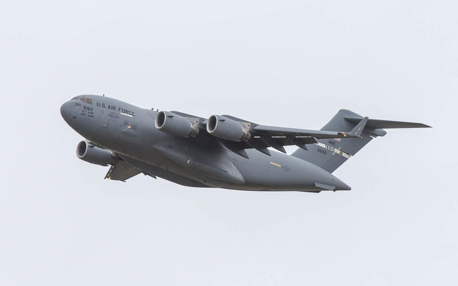 A C-17 Globemaster flies near Travis Air Force Base, Calif., May 7, 2015. A Chinese man has pleaded guilty to stealing military technical data, including data related to the C-17 strategic transport aircraft as well as some military fighter jets, and to send that stolen data to China.