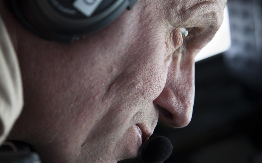 KC-135 Stratotanker Boom Operator Chief Master Sgt. Tim looks out at the aircraft he is helping refuel to ensure it is in a safe position during the entire process on March 24, 2016. Crewmembers could not be identified by their full names for security reasons.