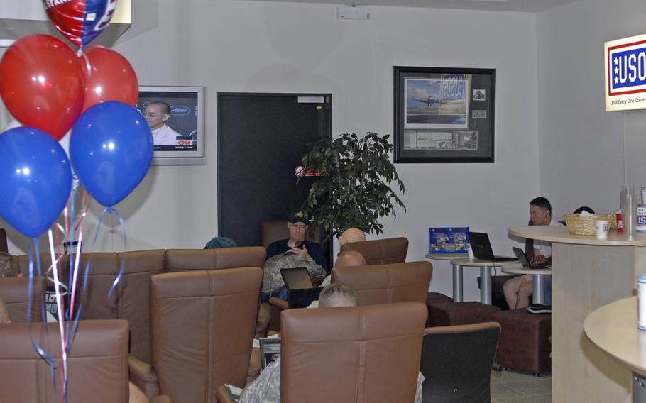 Soldiers enjoy the improved USO lounge at Frankfurt International Airport on May 26, 2010, following a grand-opening ceremony at its new location in Terminal 1, Arrival Hall C. The lounge will close permanently on April 14, 2016.