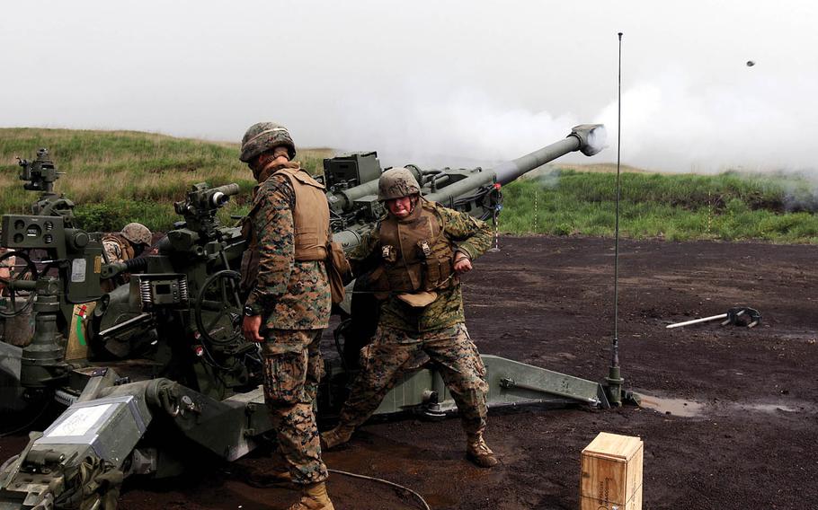 U.S. Marines conduct live-fire drills at Camp Fuji, Japan, in 2011. To deal with noise complaints, fighter-jet and artillery training will move off U.S. bases in Japan this year, the nation's Ministry of Defense announced this week.