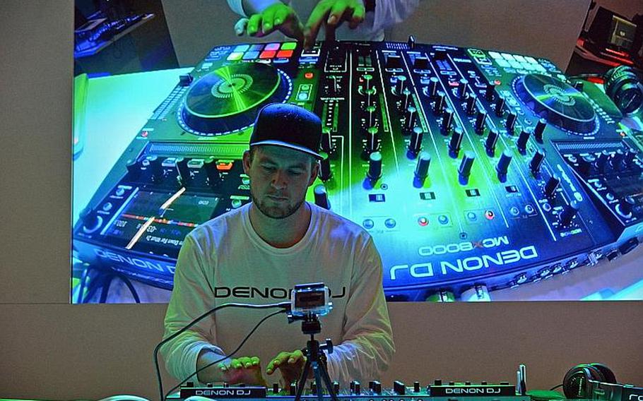 A disc jockey demonstrates a Denon DJ table at the Musikmesse in Frankfurt, Germany, Thursday, April 7, 2016.