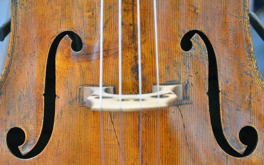 A closeup of a vintage upright acoustic bass at the E.M. Poellmann stand at the Musikmesse in Frankfurt, Germany, Thursday, April 7, 2016.