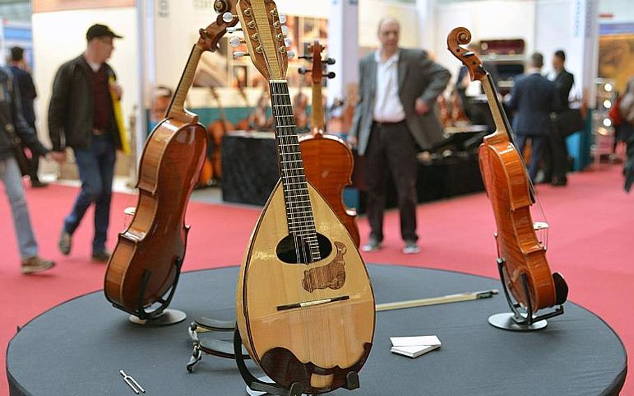 Acoustic string instruments on display at the Musikmesse in Frankfurt, Germany, Thursday, April 7, 2016.