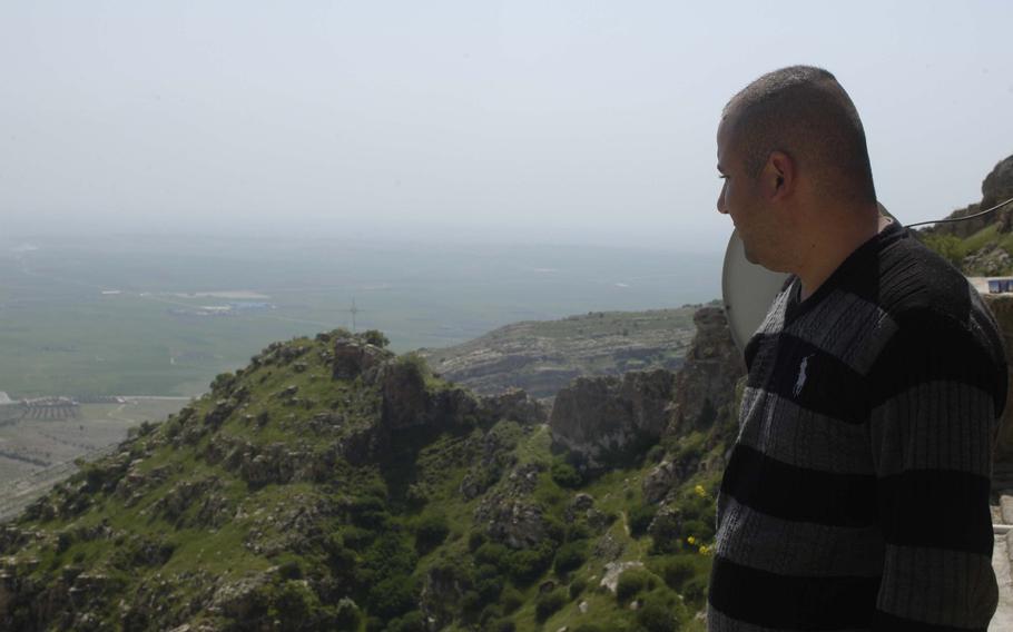 Police guarding the Sant Hormizd Monastery can see the Islamic State-held city of Mosul on a clear day. On a hazy afternoon, April 7, 2016, they could still see villages occupied by the extremists below their mountain perch.