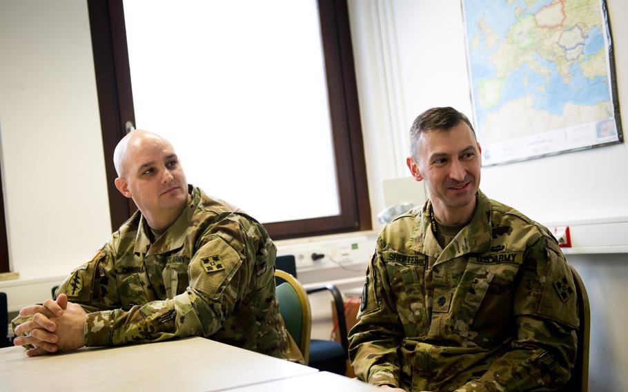 Lt. Col. Matthew Sheiffer, 4th Infantry Division Mission Command Element Chief of Staff, right, and Sgt. Maj. Jason Lamblin, 4th ID Mission Command Element Sergeant Major, discuss the command's role in planning missions for Operation Atlantic Resolve and the addition of a rotational heavy brigade planned to arrive in 2017.