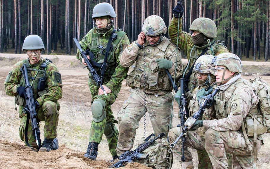 Soldiers with L Troop, 3rd Squadron, 2nd Cavalry Regiment and Lithuanian Duke Vaidotas Mechanized Infantry Battalion await commands during an airfield assault at Gaiziunai Training Area, Lithuania, March 10, 2016. Such joint training has become more frequent since the U.S. has increased its presence in eastern Europe to reassure allies wary of Russia's intentions.
