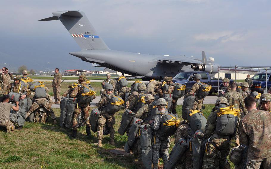 Soldiers from the 173rd Airborne Brigade get set to board a C-17 at Aviano Air Base, Italy, on Monday, April 11, 2016. The C-17 is from the Heavy Airlift Wing based at Papa Air Base in Hungary, along with other C-17s and C-130s from various other units, dropped hundreds of troops and tons of equipment onto a drop zone near Hohenfels, Germany, as part of exercise Saber Junction.