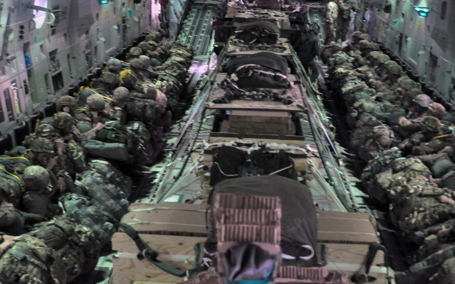 The lights were dimmed while the C-17 was en route from Aviano Air Base, Italy to Hohenfels, Germany on Monday, April 11, 2016, as part of exercise Saber Junction. Four pallets and 51 airborne troops made it out the aircraft. Six troops had to return to Aviano after winds were judged to be too strong on the aircraft's third pass over the zone.