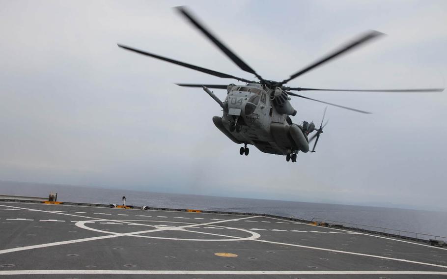 A Super Stallion helicopter lands on the flight deck of the USNS Millinocket near the coast of Panay, Philippines, during Exercise Balikatan, Tuesday, April 12, 2016. The Millinocket was used as a command-and-control center for parts of the exercise.