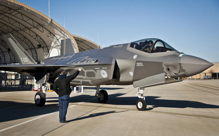 Maj. Laurens Vijge, a Royal Netherlands Air Force pilot, salutes his Lockheed Martin crew chief as he taxis out for the first flight in the F-35A Lightning II in December 2013 at Eglin Air Force Base, Fla. The joint strike fighter is slated to make its international debut at the Leeuwarden Air Show in the Netherlands in June.