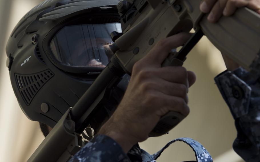 A sailor from a Bahraini Royal Navy special task force readies his weapon during a visit, board, search and seizure demonstration for the International Mine Countermeasures Exercise at Naval Support Activity Bahrain April 9, 2016.