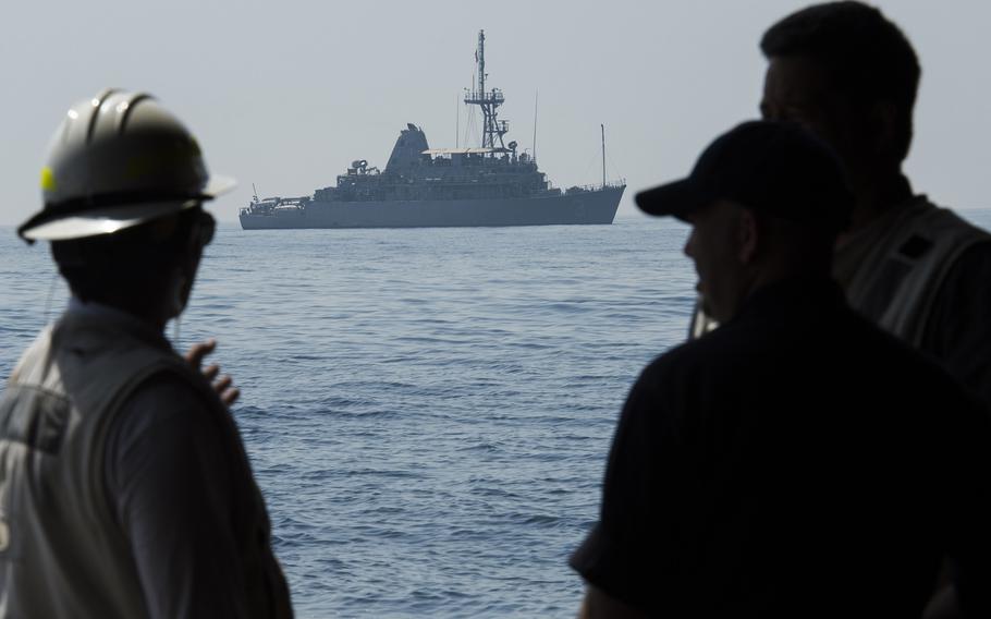 Personnel aboard the afloat forward staging base USS Ponce communicate while the Ponce crew is getting media personnel to and from a mine countermeasures ship in the Persian Gulf during the International Mine Countermeasures Exercise April 10, 2016.