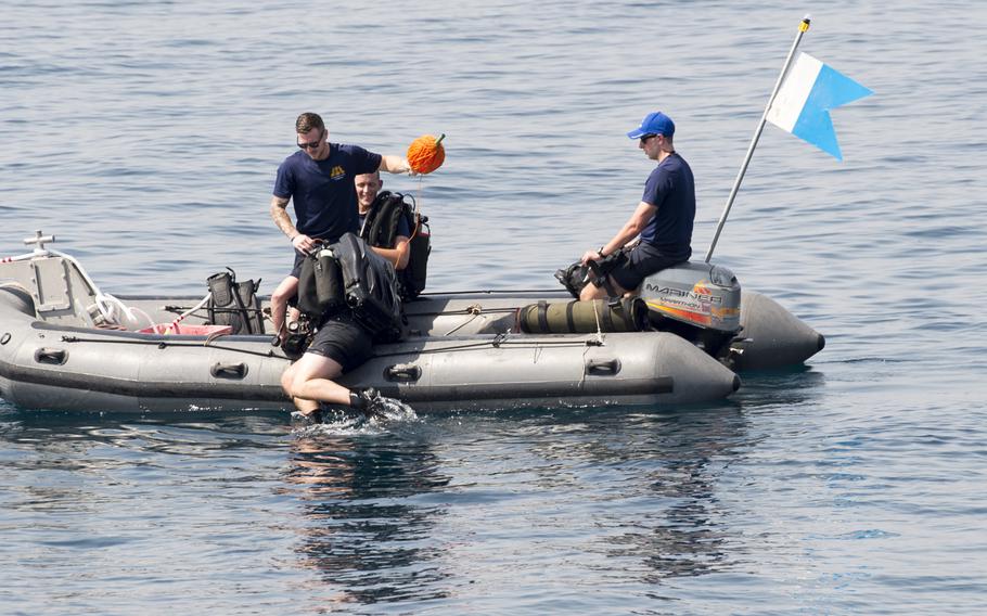 A British diver from the Royal Navy gently exits a rigid-hulled inflatable boat into the water of the Persian Gulf during a demonstration for the International Mine Countermeasures Exercise April 10, 2016. Divers preparing for mine countermeasures operations must enter the water as quietly as possible to avoid the possibility of setting off certain types of mines.