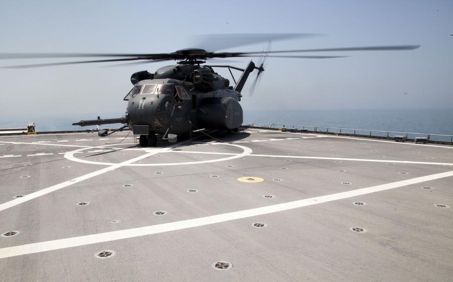 An MH-53E Sea Dragon, which is used by the U.S. Navy for airborne mine countermeasure missions, sits on the flight deck of the USNS Choctaw County while preparing to transit media to the afloat forward staging base USS Ponce during the International Mine Countermeasures Exercise on April 10, 2016.