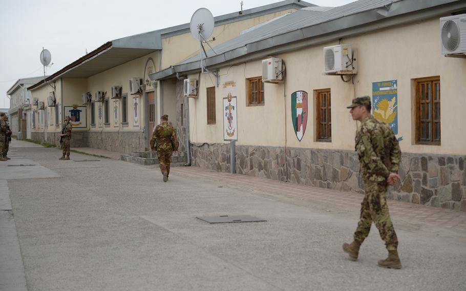 Italian soldiers walk around Camp Arena in Afghanistan's Herat province on April 7, 2016. Under current plans, the NATO base - which includes Herat Airfield - will eventually be turned over to the Afghanistan Airfield Economic Development Commission to be transformed into a special economic zone.