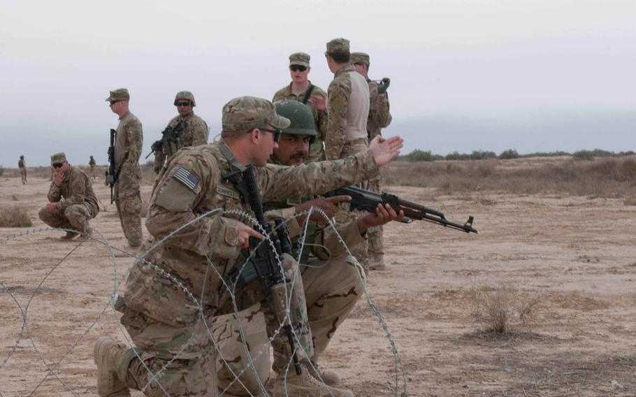 A U.S. soldier with the 82nd Airborne Division instructs an Iraqi soldier during a breach and assault training at Besmaya Range Complex, Iraq, in March 2015. Secretary of Defense Ash Carter arrived in Baghdad Monday, April 18, 2016, to discuss the possibility of sending additional U.S. troops and other support to Iraq as its army begins the fight for Mosul.