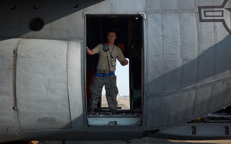 An airman from Yokota Air Base performs a preflight inspection of a C-130 Hercules at Yokota Air Base, Japan Tuesday, April 19, 2016.