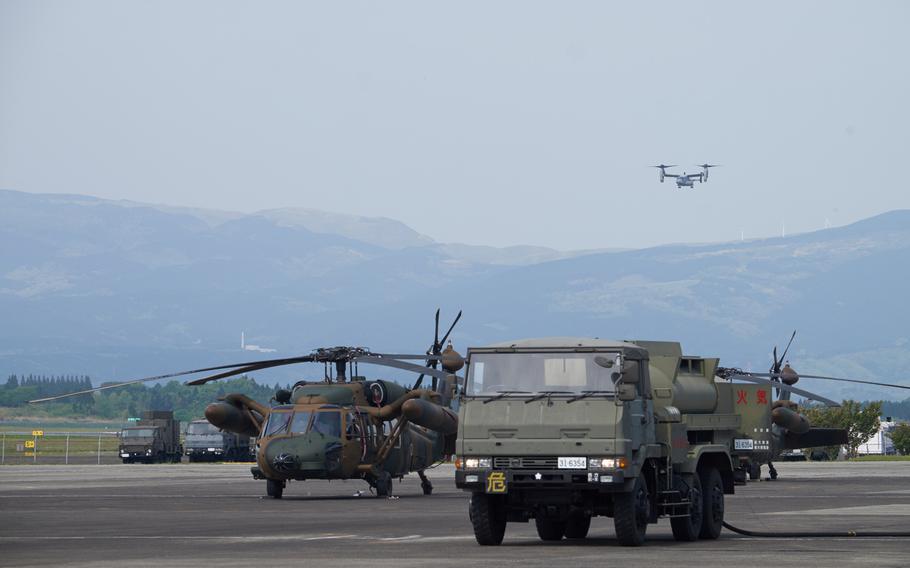 A U.S. MV-22 Osprey from the 31st Marine Expeditionary Unit appear over the mountains at Camp Takayubaru in Kumamoto, Japan, on Wednesday, April 20, 2016. This was the tenth Osprey mission since the Marines arrived Monday.