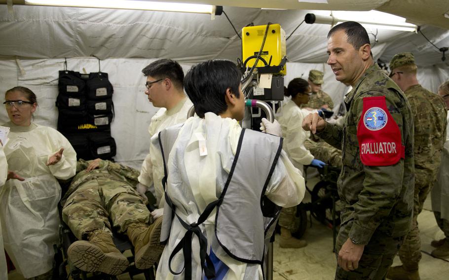Medical personnel from the 212th Combat Support Hospital perform a mass-casualty exercise for a NATO evaluation team in Miesau, Germany, on Wednesday, April 20, 2016. The evaluation team will give its recommendation on whether the expeditionary medical facility will be certified before upcoming Operation Anakonda set to take place in Poland this summer.